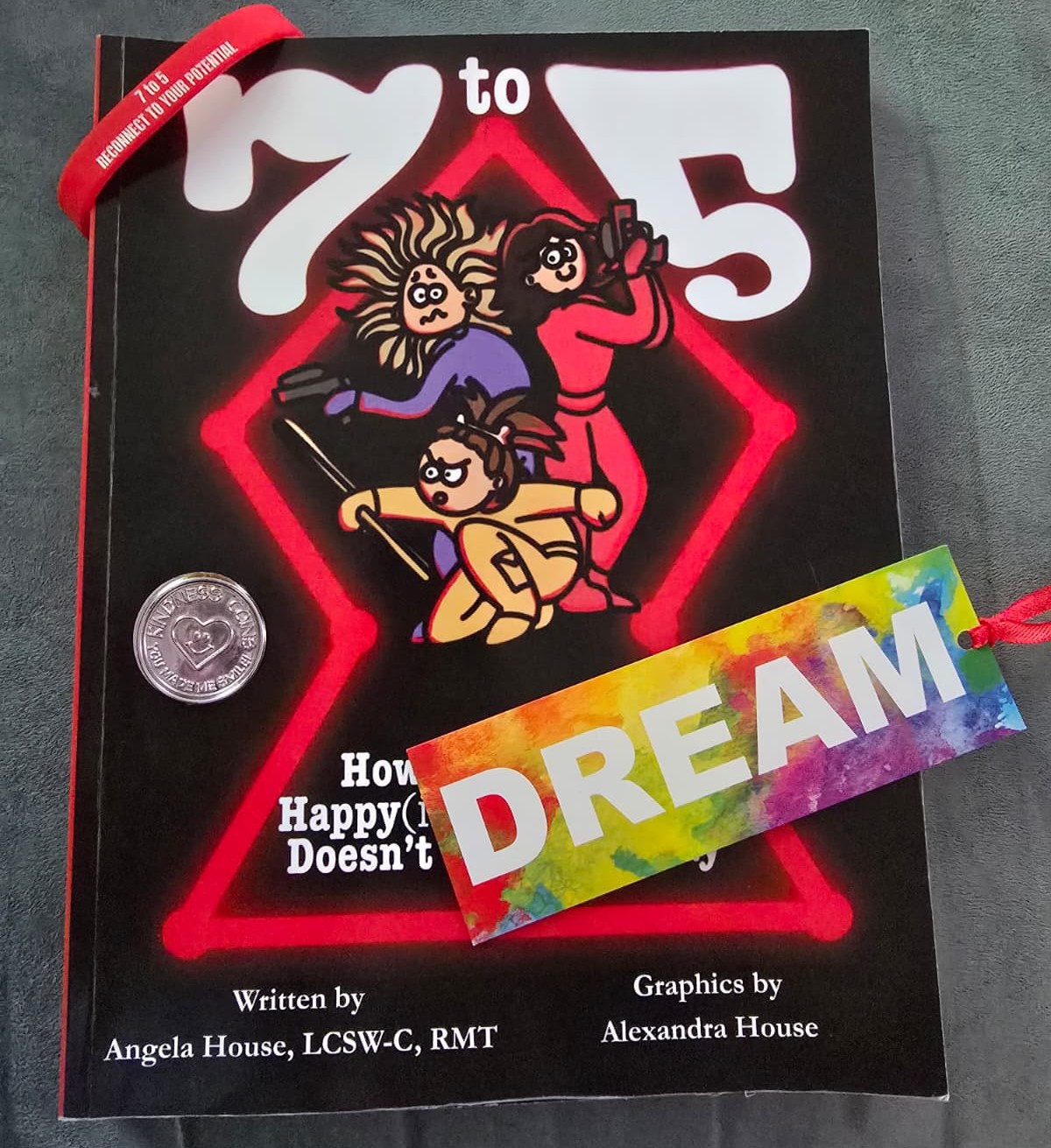 The Happyish Humans kit — signed book, coin, pen and bookmark, together.